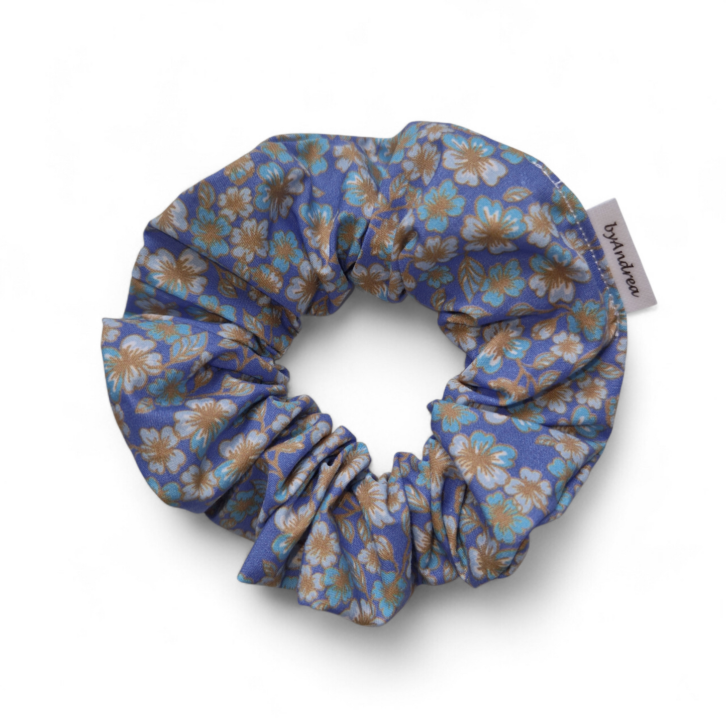 Scrunchie småblomster på blå bakgrunn