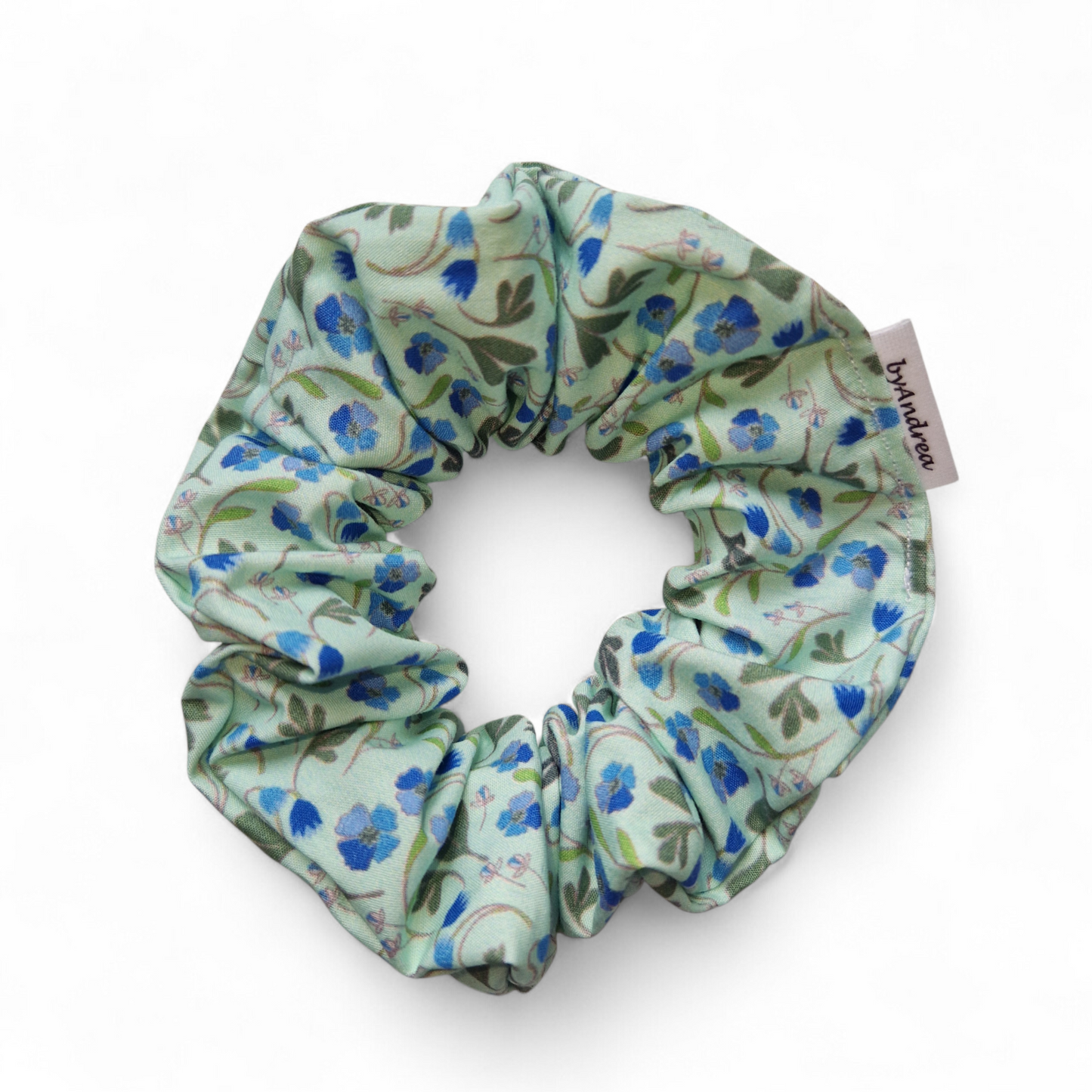 Scrunchie blå fioler på turkis bakgrunn